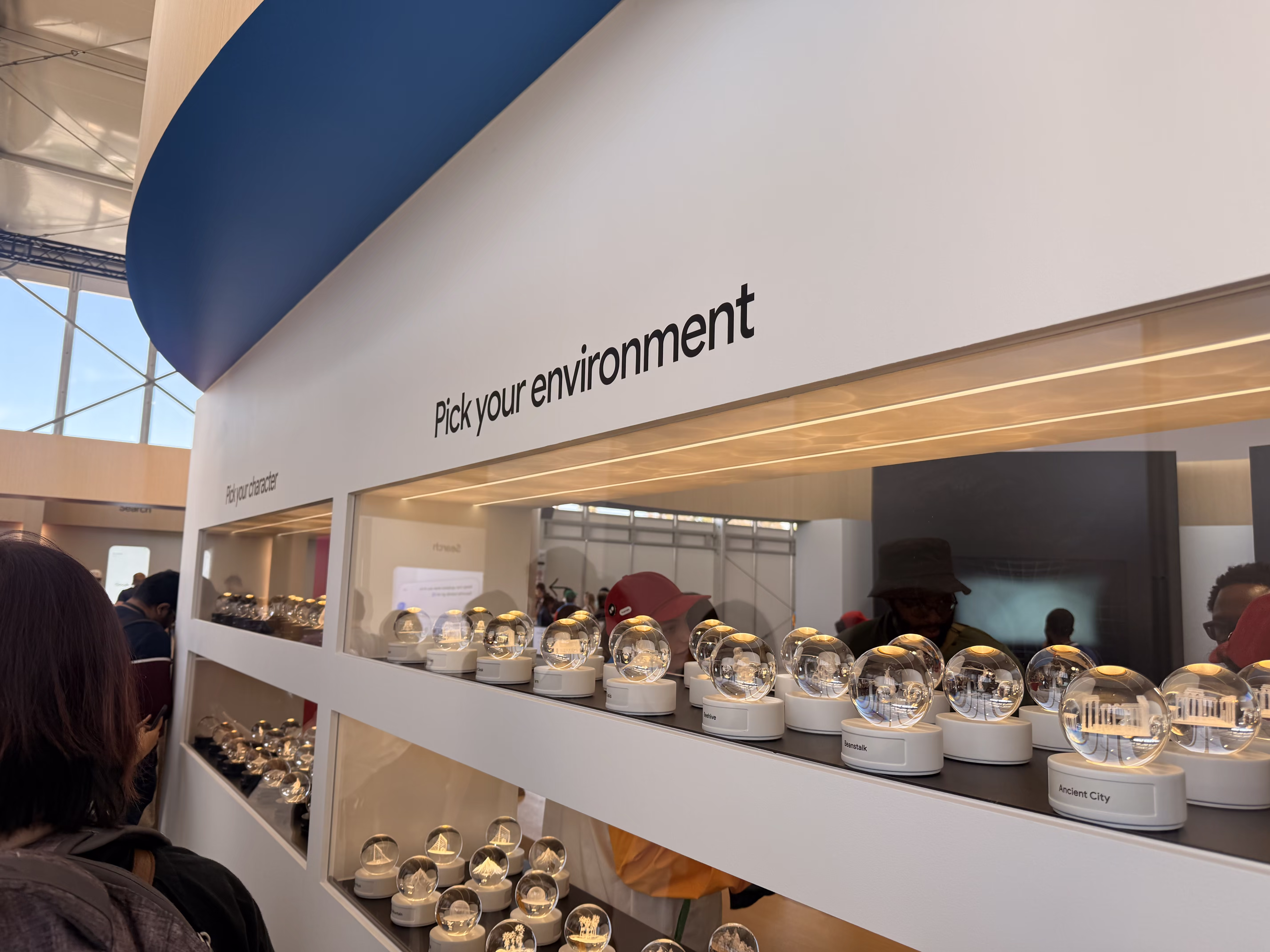 Wall of Project Genie crystal globes at Google I/O 2026 with the prompt "Pick your environment".