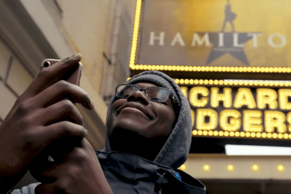 Hamilton app showing a selfie with Hamilton stickers